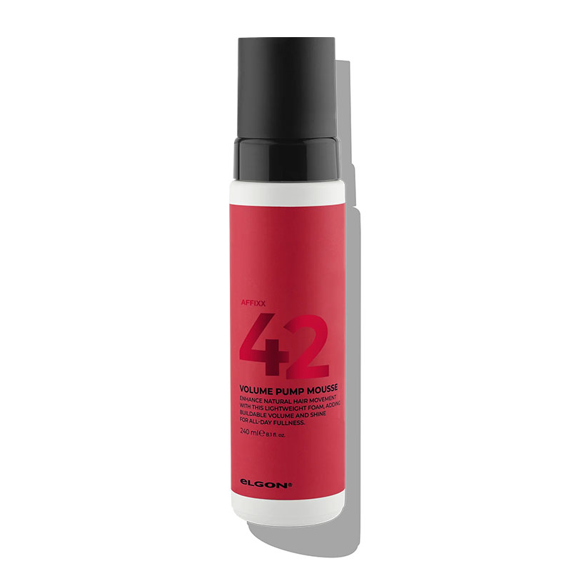 Flacone bianco con etichetta rossa con scritte nere e tappo nero.