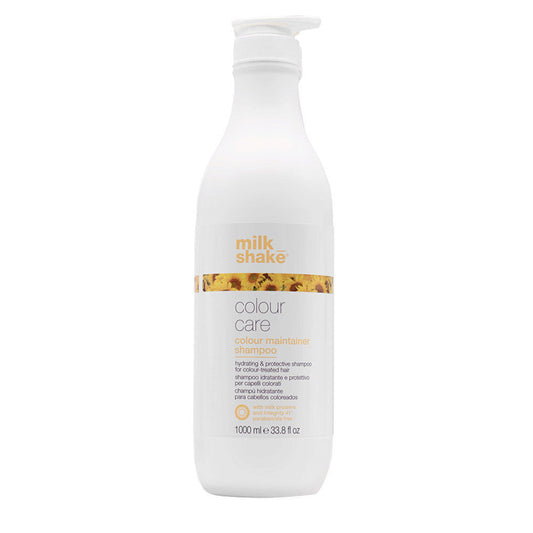 Bottiglia di shampoo da litro bianca con tappo a pressione. Piccola immagine con richiamo al fiore di girasole sulla facciata principale.