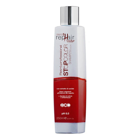 Bottiglia di shampoo bianca con scritte rosse e tappo flip top argentato e bianco.